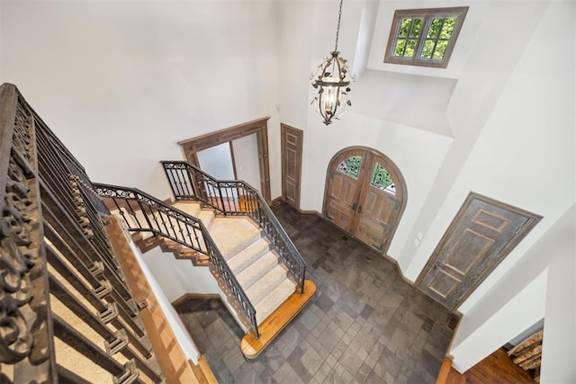 entrance foyer featuring a notable chandelier and a high ceiling