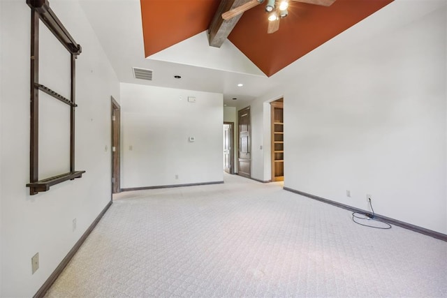 carpeted spare room featuring high vaulted ceiling, ceiling fan, and beam ceiling