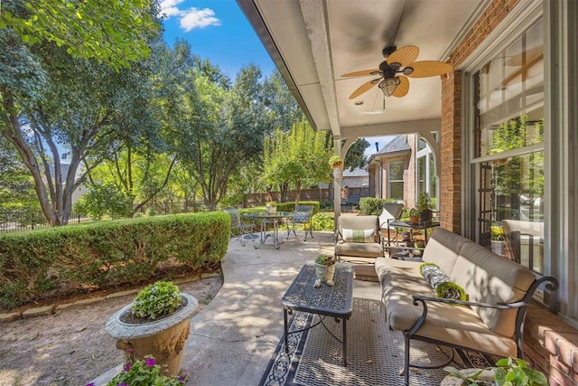 view of patio / terrace with an outdoor living space and ceiling fan