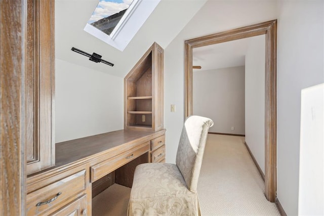 home office featuring vaulted ceiling and light colored carpet