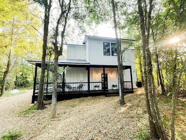 view of front of house with covered porch and metal roof