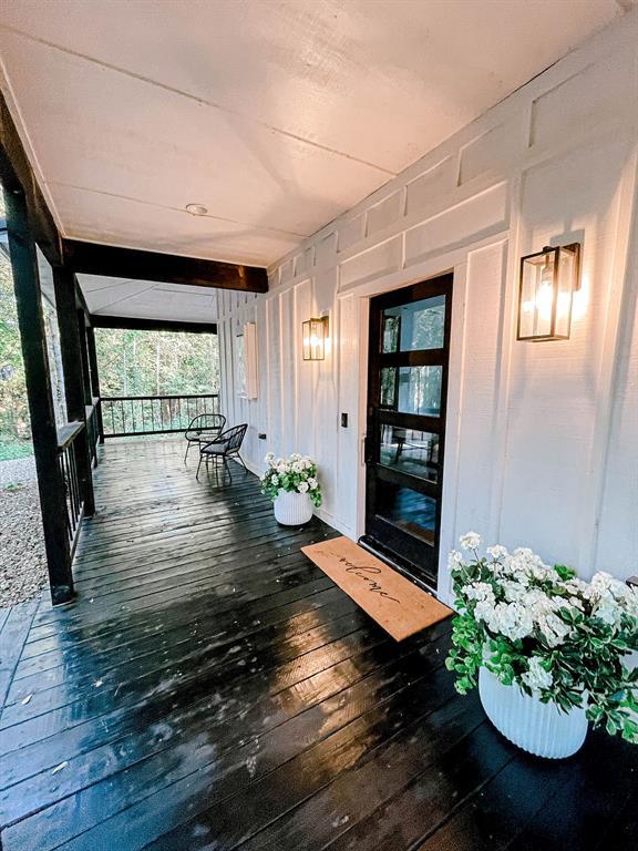 view of exterior entry with a porch