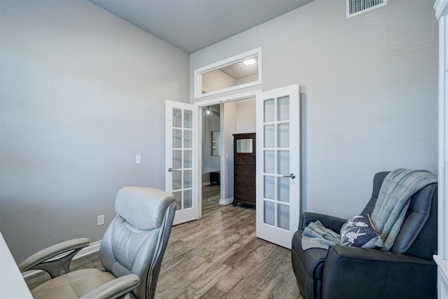 office area featuring french doors and hardwood / wood-style floors