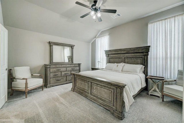 carpeted bedroom featuring lofted ceiling and ceiling fan