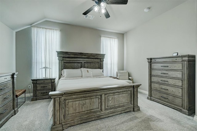 carpeted bedroom with lofted ceiling and ceiling fan