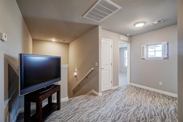 interior space featuring light colored carpet