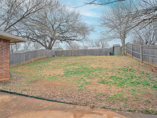 view of yard featuring an outbuilding and a fenced backyard