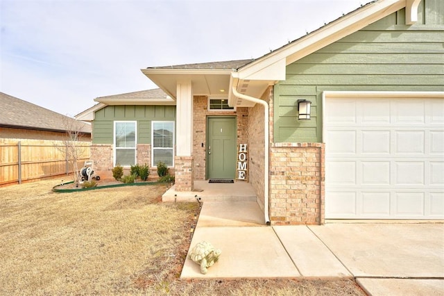 view of exterior entry with a garage