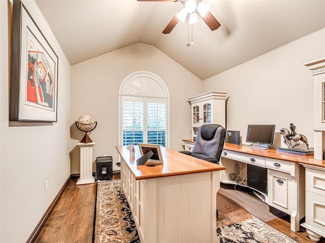 home office with dark hardwood / wood-style flooring, ceiling fan, and vaulted ceiling