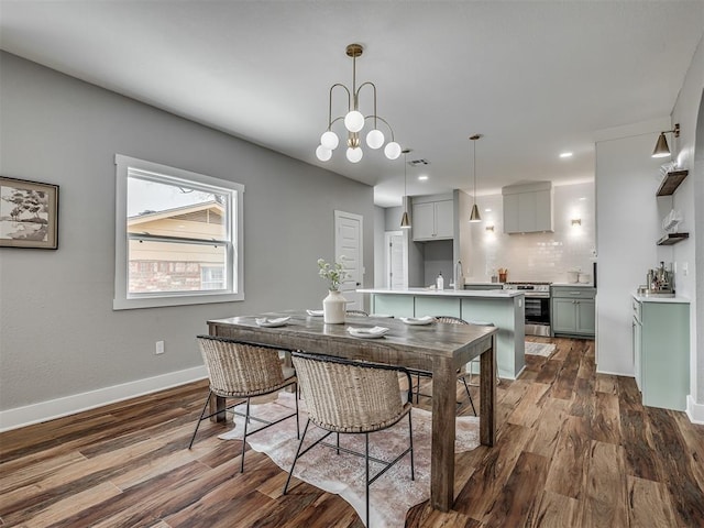 dining room featuring visible vents, baseboards, dark wood finished floors, and recessed lighting