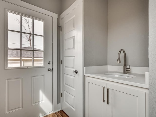 1413 NE 14th St, Oklahoma City, OK 73117 - entryway with a sink, plenty of natural light, and wood finished floors