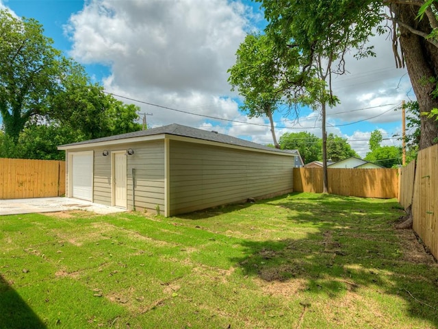 1413 NE 14th St, Oklahoma City, OK 73117 - view of yard with a detached garage and an outdoor structure