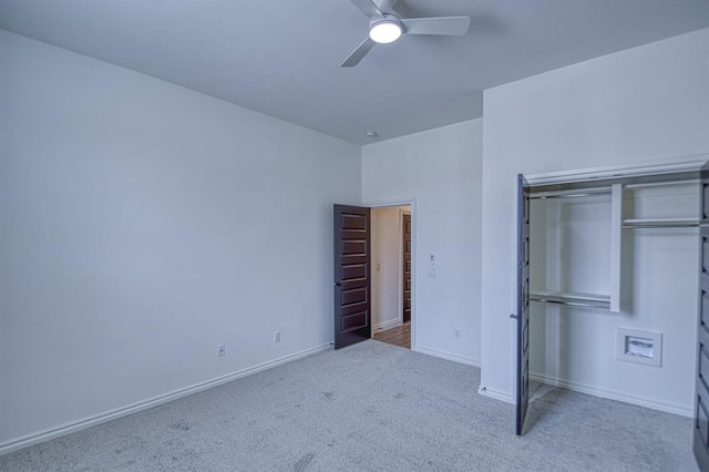 unfurnished bedroom featuring a closet, ceiling fan, baseboards, and carpet floors