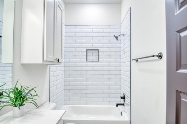 bathroom featuring toilet, bathtub / shower combination, and vanity