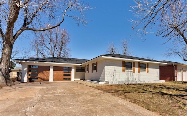 view of front of house featuring a garage and concrete driveway