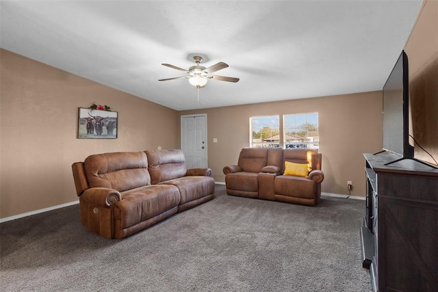 living room with carpet, baseboards, and a ceiling fan