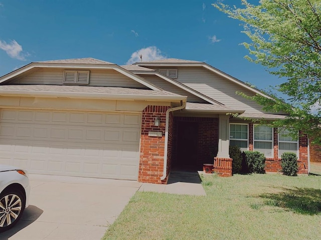 view of front of property with a garage, concrete driveway, roof with shingles, a front lawn, and brick siding