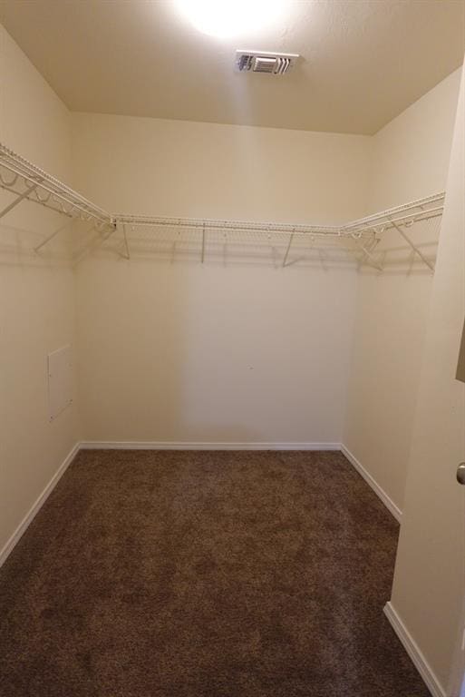 2841 NW 184th Ter, Edmond, OK 73012 - spacious closet with dark colored carpet and visible vents