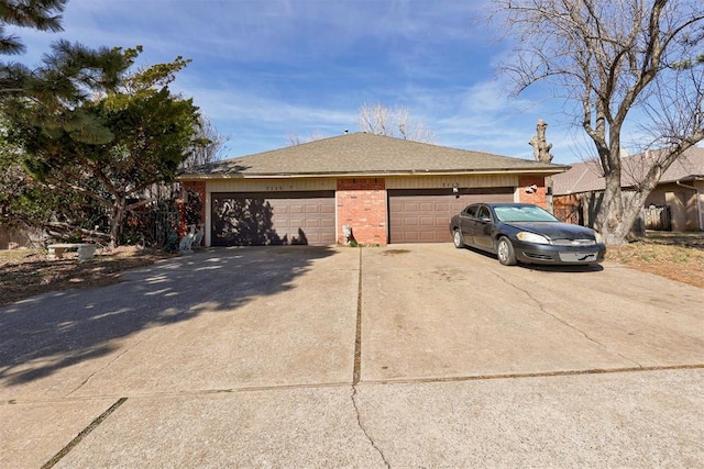 view of front of house with a garage, concrete driveway, brick siding, and a shingled roof