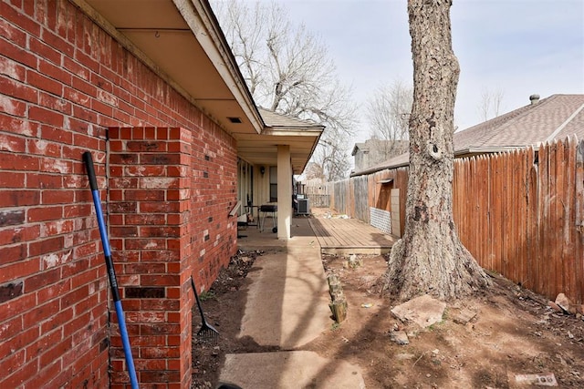 view of yard with fence private yard, a patio area, and cooling unit