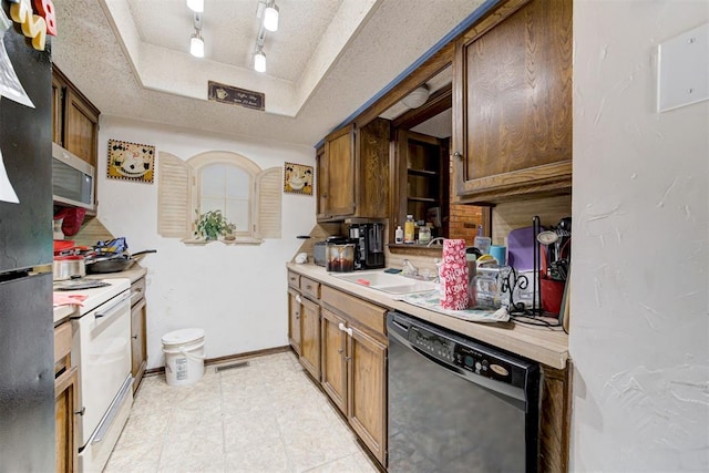 kitchen featuring black dishwasher, white range with electric stovetop, brown cabinets, light countertops, and a textured ceiling