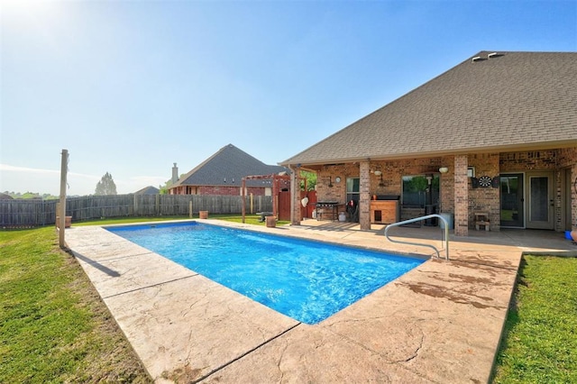 4220 Caribou St, Tuttle, OK 73089 - view of swimming pool with a lawn, a fenced backyard, a fenced in pool, and a patio