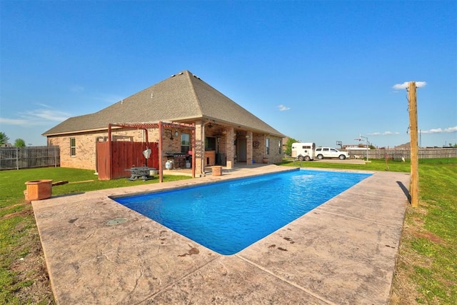 4220 Caribou St, Tuttle, OK 73089 - view of swimming pool featuring fence, a patio area, a fenced in pool, and a yard