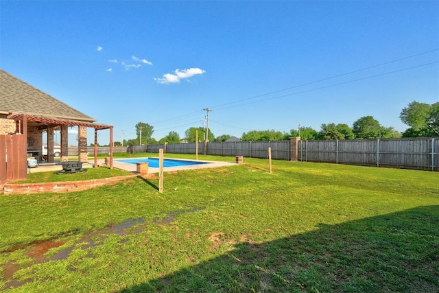 4220 Caribou St, Tuttle, OK 73089 - view of yard featuring a fenced backyard, a fenced in pool, and a patio