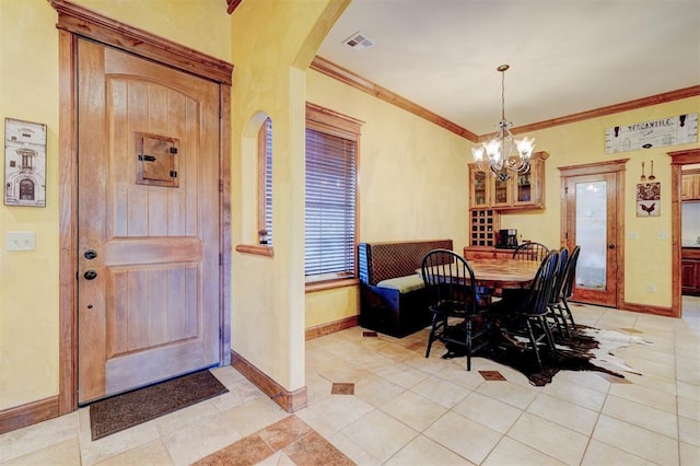 4220 Caribou St, Tuttle, OK 73089 - entryway featuring light tile patterned flooring, arched walkways, an inviting chandelier, baseboards, and visible vents