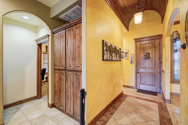 4220 Caribou St, Tuttle, OK 73089 - entrance foyer featuring arched walkways, vaulted ceiling, visible vents, and wooden ceiling