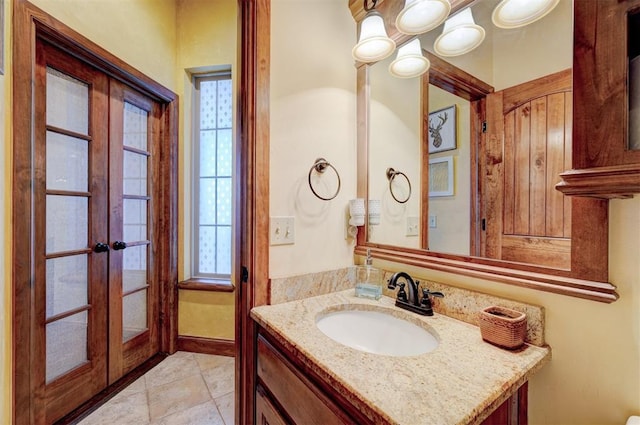 4220 Caribou St, Tuttle, OK 73089 - bathroom with french doors and vanity