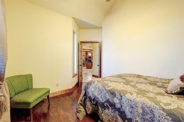 4220 Caribou St, Tuttle, OK 73089 - bedroom with lofted ceiling, baseboards, and wood finished floors