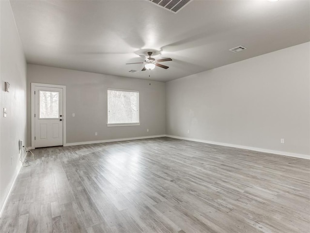 unfurnished living room with ceiling fan and light wood-type flooring