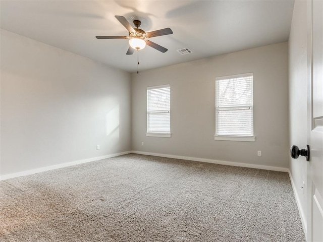 unfurnished room featuring carpet floors and ceiling fan