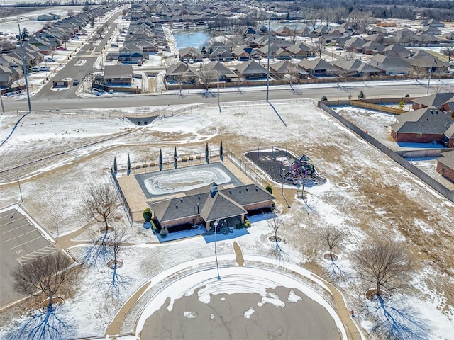 snowy aerial view featuring a residential view