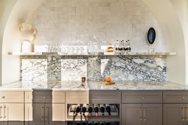 20945 Alba Ct, Edmond, OK 73012 - indoor dry bar featuring decorative backsplash