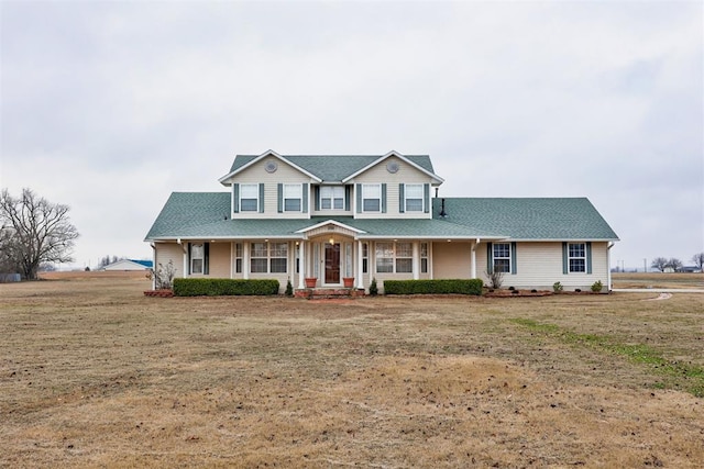 view of front of house with a front lawn and a porch