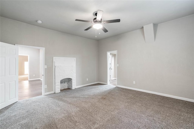 unfurnished living room with ceiling fan and carpet floors