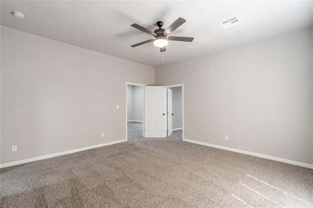 empty room featuring carpet and ceiling fan