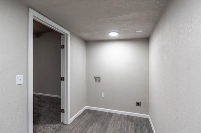 laundry area featuring a textured ceiling, hardwood / wood-style flooring, hookup for a washing machine, and electric dryer hookup