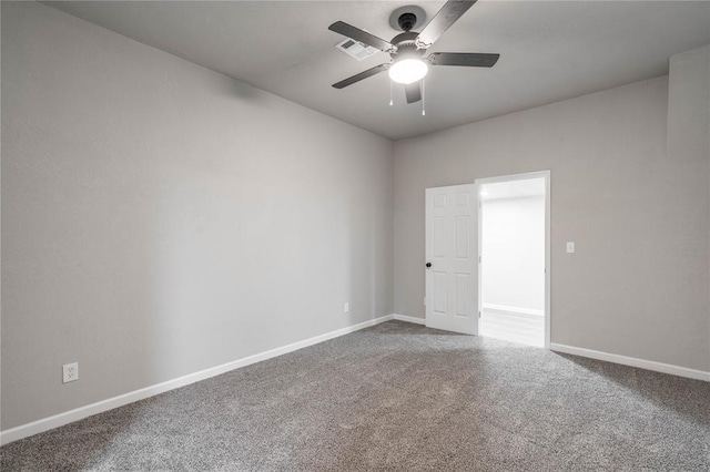 carpeted empty room with ceiling fan