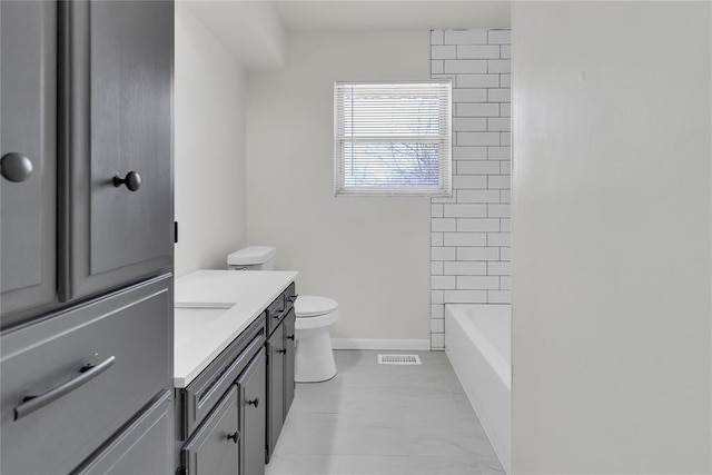 bathroom with toilet, baseboards, visible vents, and vanity