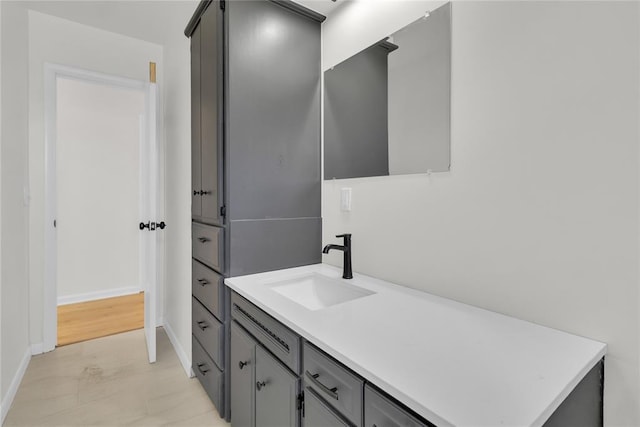 bathroom featuring vanity and baseboards