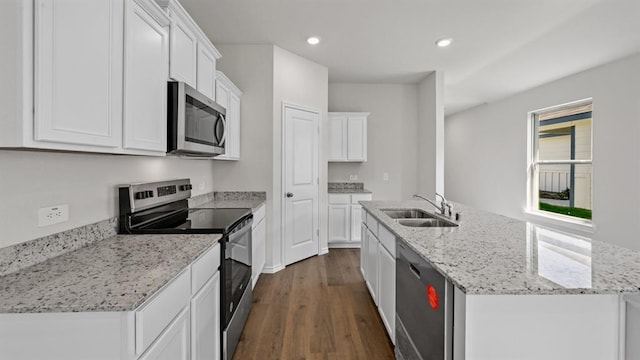 kitchen with sink, appliances with stainless steel finishes, and white cabinets