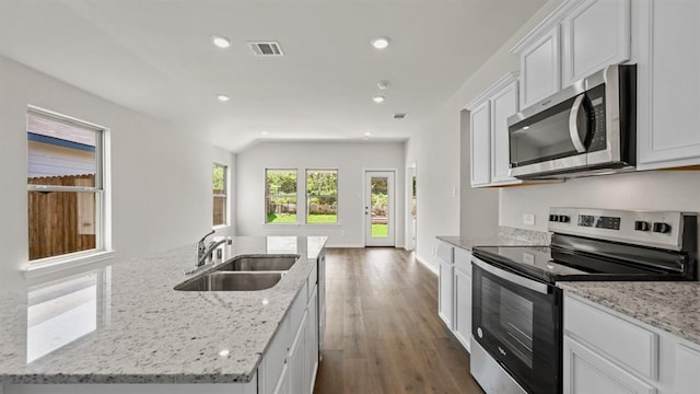 kitchen with sink, a center island with sink, white cabinetry, and stainless steel appliances