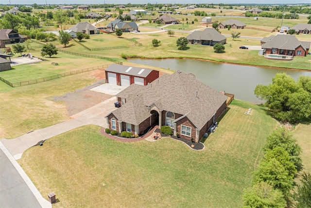 aerial view featuring a residential view and a water view