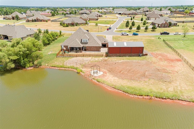 aerial view with a water view and a residential view