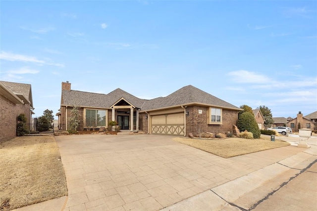 ranch-style house with a garage, brick siding, fence, driveway, and a chimney