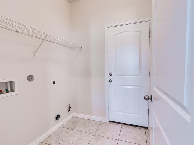 washroom featuring baseboards, washer hookup, laundry area, light tile patterned flooring, and hookup for an electric dryer