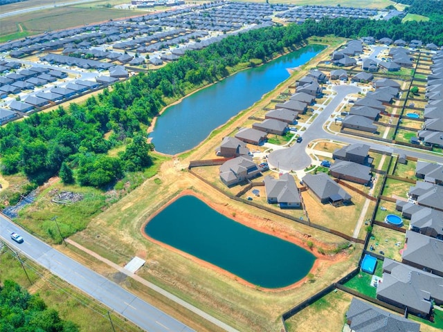 aerial view with a residential view and a water view